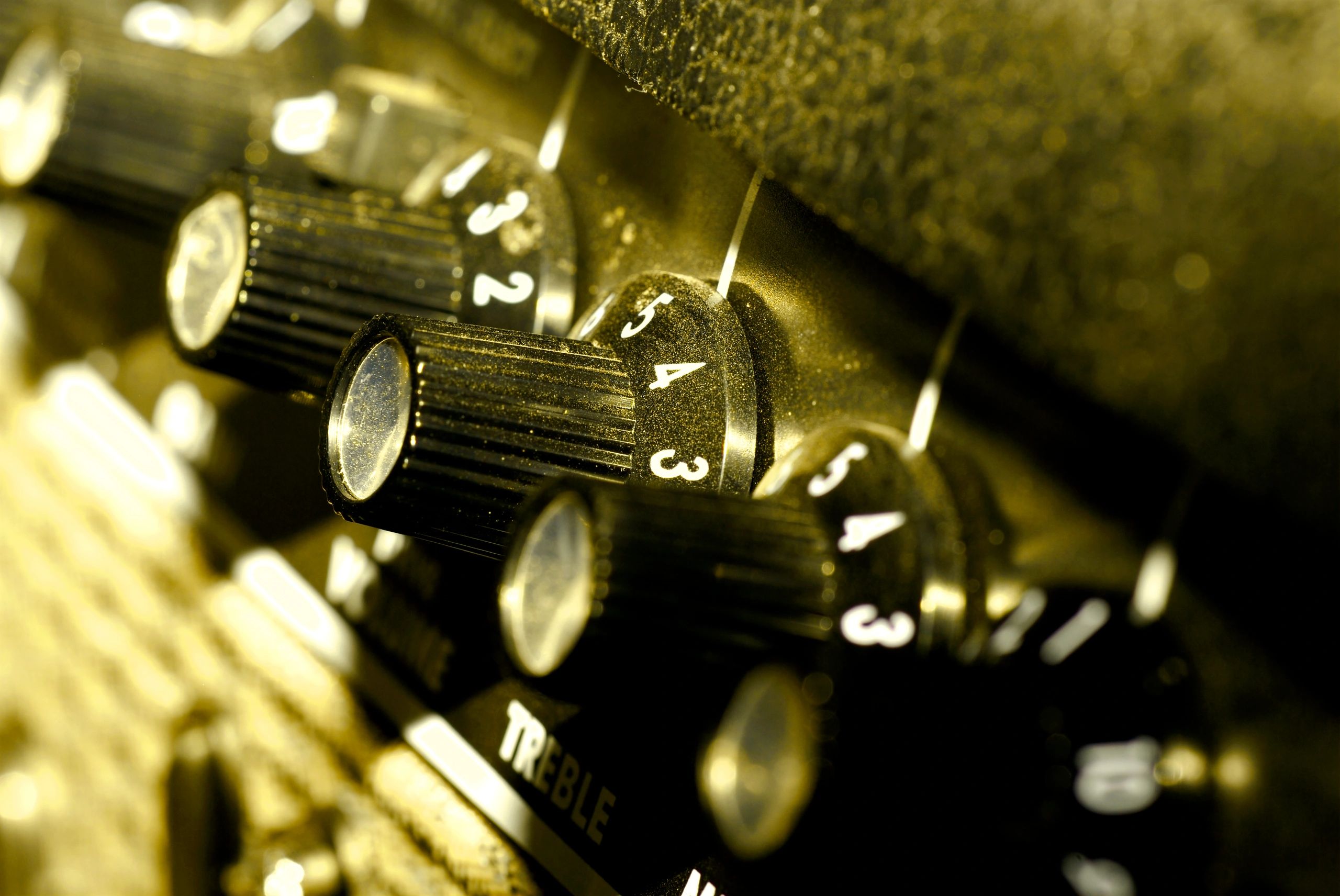 Close-up of vintage amplifier controls and knobs