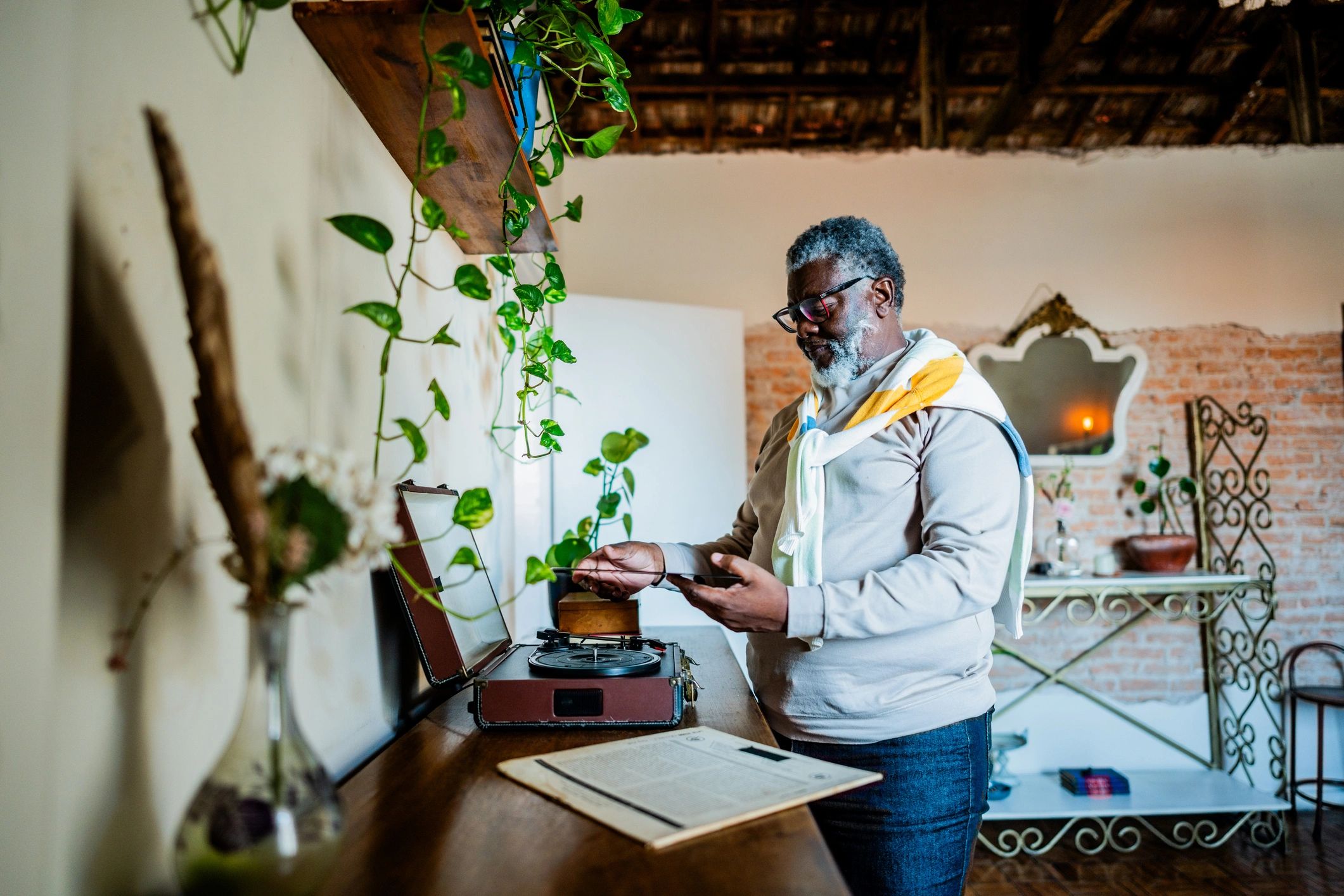 Collector listening to music on a turntable