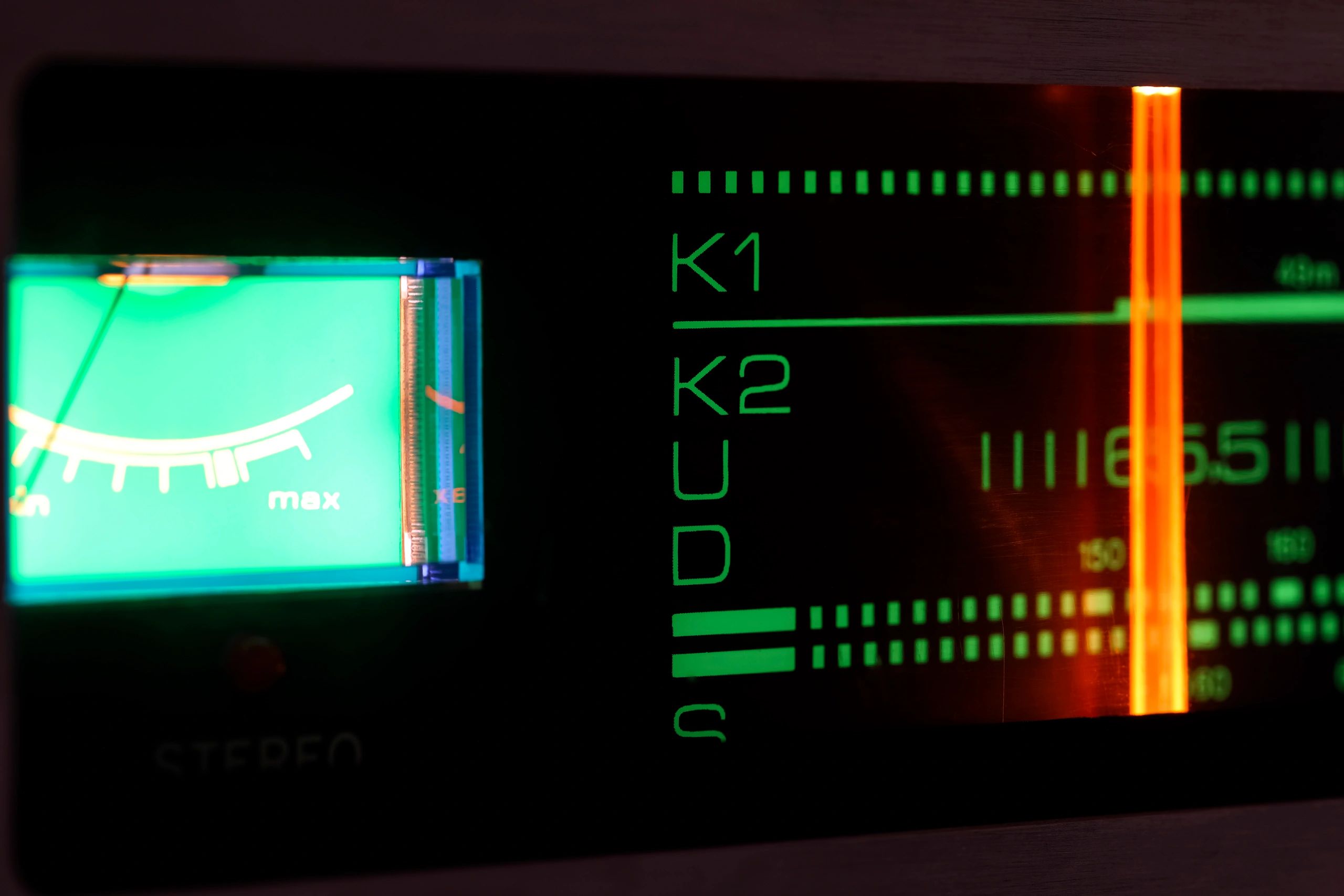 Analog radio receiver dial and tuning indicator close-up
