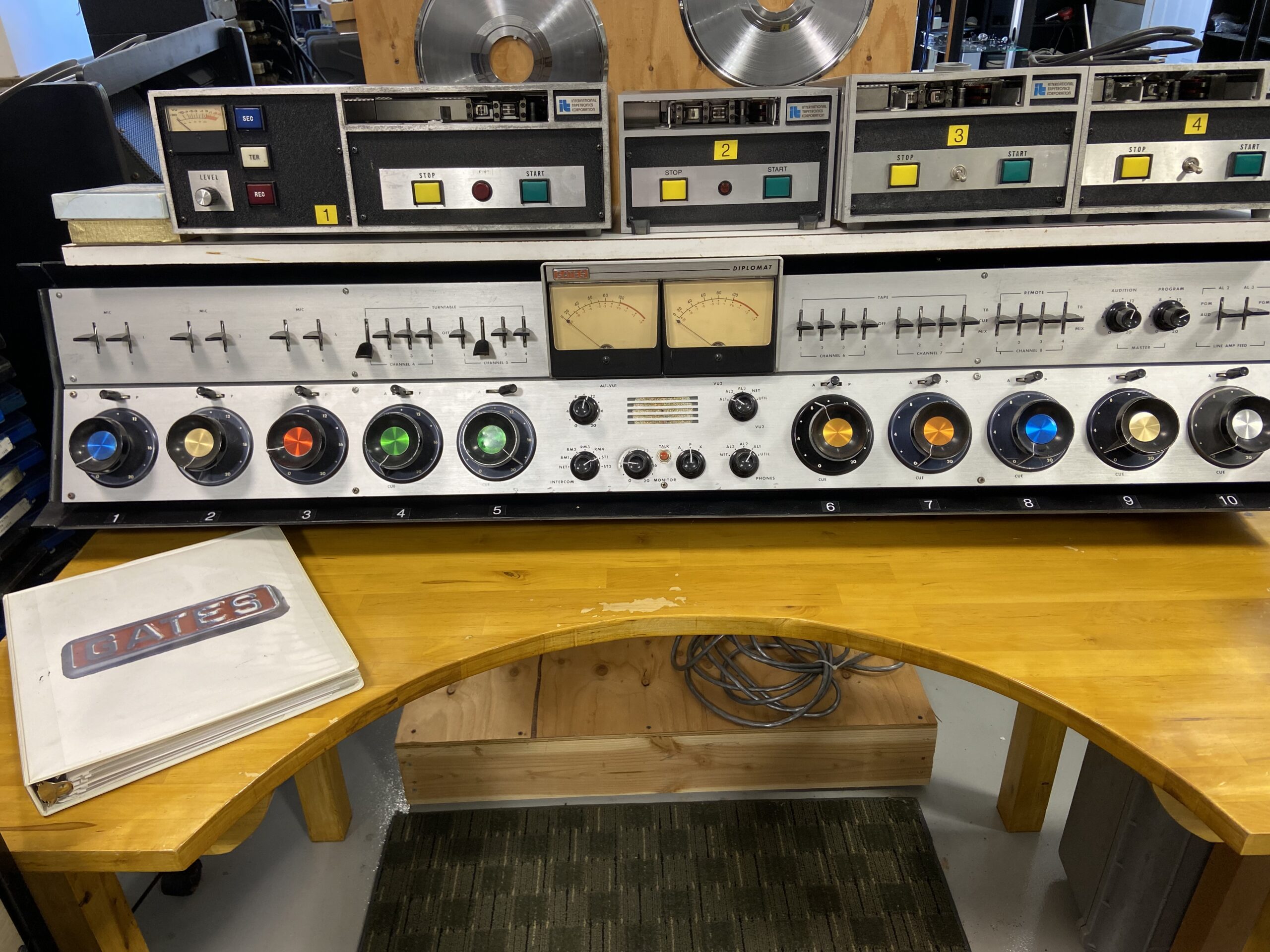 Gates Diplomat 10 channel audio board with manual and ITC Cart Machines on top